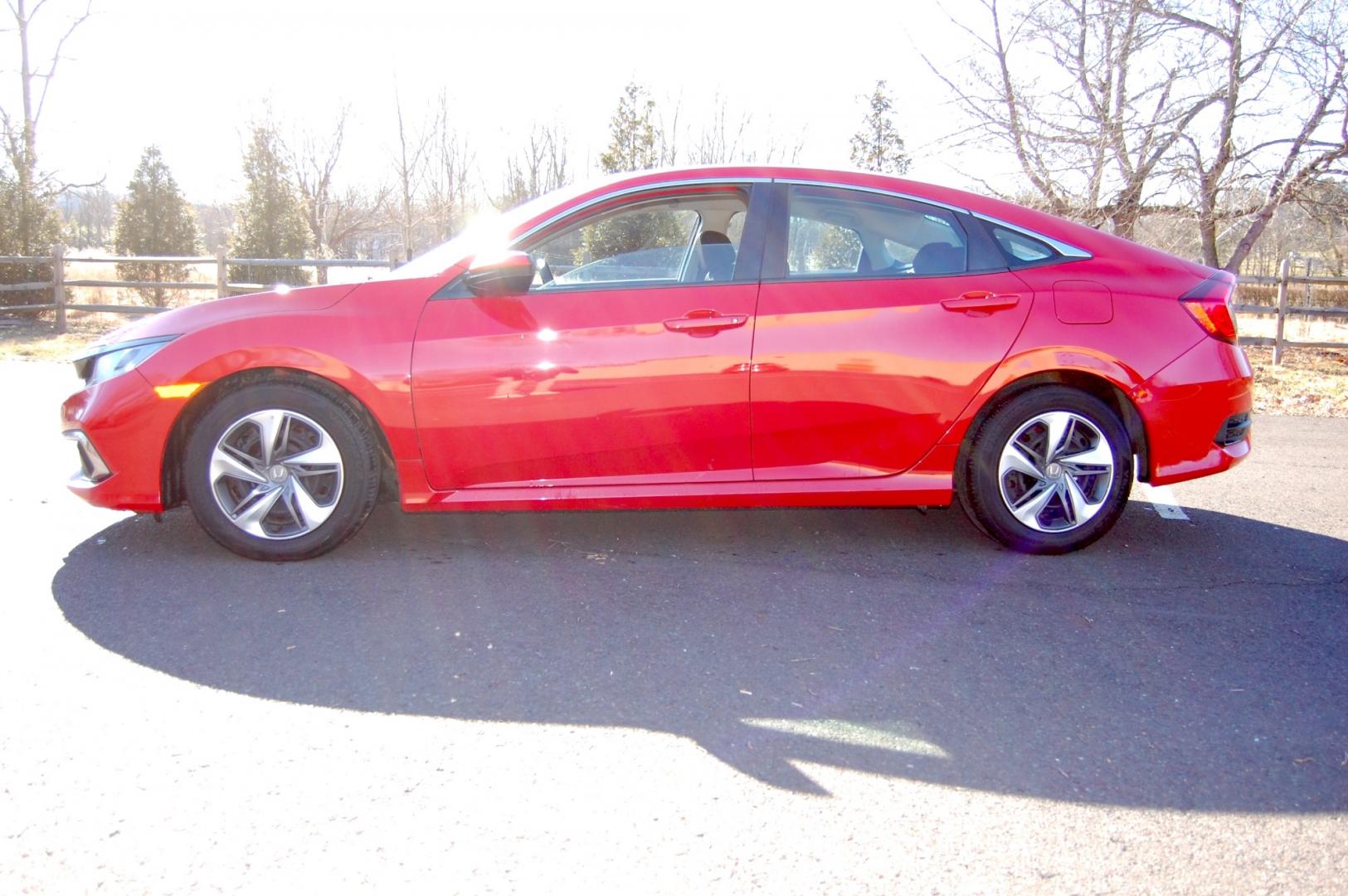 2019 RED /Black Cloth Honda Civic (2HGFC2F60KH) with an 2.0 Liter engine, Automatic transmission, located at 6528 Lower York Road, New Hope, PA, 18938, (215) 862-9555, 40.358707, -74.977882 - One family owned 2019 Honda Civic LX sedan powered by a 2.0 Liter 4 cylinder engine, front wheel drive, automatic transmission. Tilt wheel, cruise control, Dual front and side air bags, Side curtains airbags, ABS braking, AM/FM/Bluetooth/USB, Auto climate control, power windows, locks and mirrors, 1 - Photo#1